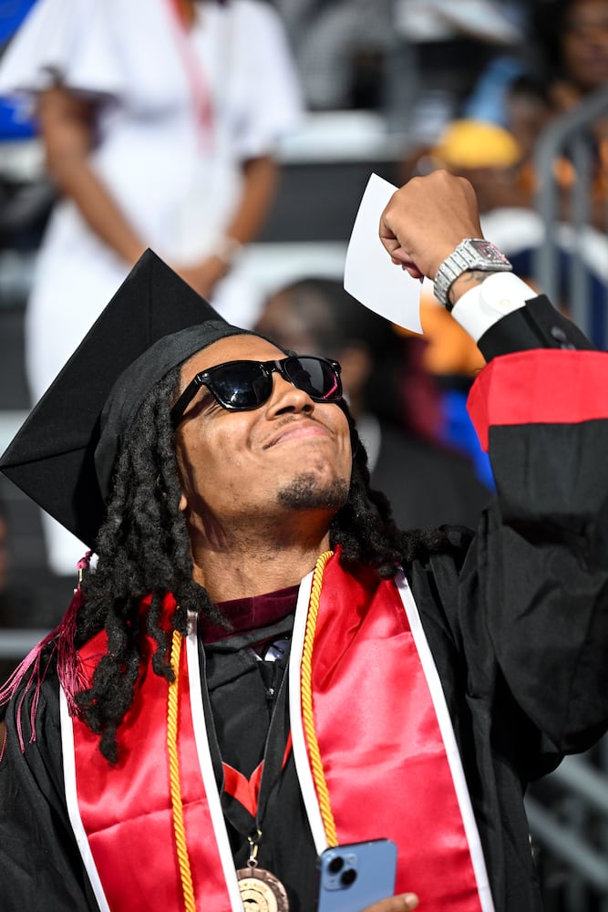Tequez Williams reacts as he walks across the state during Clark Atlanta University’s 2025 commencement ceremony Sunday, May 18, 2025 at Georgia State’s Convocation Center. (Daniel Varnado/For the Atlanta Journal-Constitution)