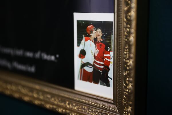 A Polaroid photo of “Heated Rivalry” actors Connor Storrie and Hudson Williams is displayed during a book club event at All the Tropes Bookstore. (Abbey Cutrer/AJC)