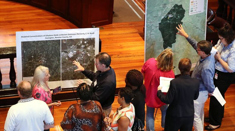 Local residents look over maps of the estimated total cancer risk and modeled concentrations of ethylene oxide at the Becton Dickinson plant during the EPA/EPD presentation at the Old Newton County Courthouse on Tuesday, Aug. 20, 2019, in Covington. CURTIS COMPTON/CCOMPTON@AJC.COM