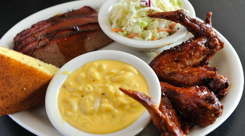 Memphis BBQ Co. in Dunwoody BBQ Combo Platter with smoked wings, brisket, mac & cheese, cole slaw and sour cream cracked pepper cornbread. (Beckysteinphotography.com)