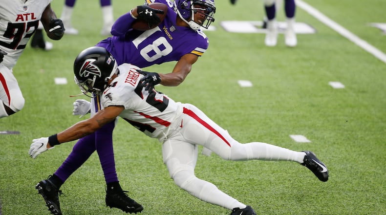 Minnesota Vikings wide receiver Justin Jefferson (18) is tackled by Atlanta Falcons cornerback A.J. Terrell during the first half Sunday, Oct. 18, 2020, in Minneapolis. (Bruce Kluckhohn/AP)