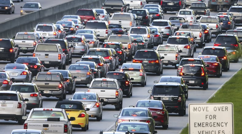 The gridlock of rush hour traffic along GA 400. JOHN SPINK / JSPINK@AJC.COM
