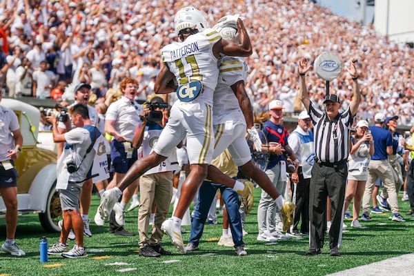 Georgia Tech wide receiver Dean Patterson #11 and wide receiver Malik Rutherford #8 celebrate after a successful two-point conversion  during the second half of a game against the Clemson Tigers on Saturday, Sept. 13, 2025, in Atlanta, at Bobby Dodd Stadium. (Atlanta Journal-Constitution/Jason Allen)