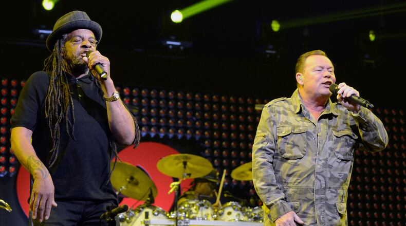Musicians Astro, left, and Ali Campbell of UB40 perform on stage during the iHeart80s Party 2017 at SAP Center on Jan. 28, 2017, in San Jose.