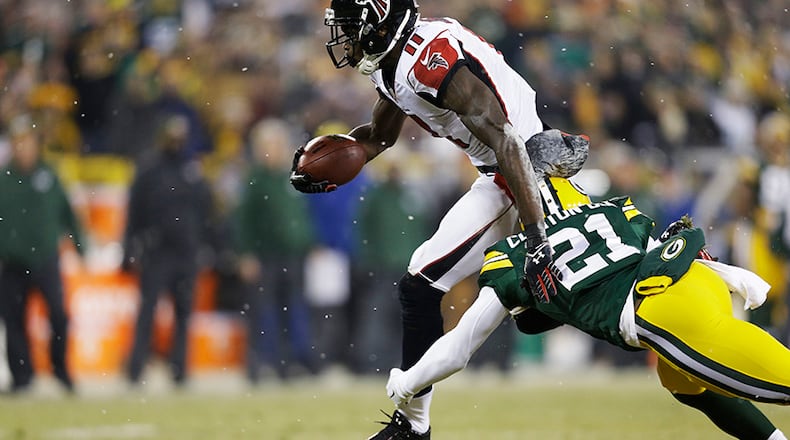 GREEN BAY, WI - DECEMBER 08: Julio Jones #11 of the Atlanta Falcons completes a reception against the defense of Ha Ha Clinton-Dix #21 of the Green Bay Packers in the first quarter at Lambeau Field on December 8, 2014 in Green Bay, Wisconsin. (Photo by Mike McGinnis/Getty Images) GREEN BAY, WI - DECEMBER 08: Julio Jones #11 of the Atlanta Falcons completes a reception against the defense of Ha Ha Clinton-Dix #21 of the Green Bay Packers in the first quarter at Lambeau Field on December 8, 2014 in Green Bay, Wisconsin. (Photo by Mike McGinnis/Getty Images)