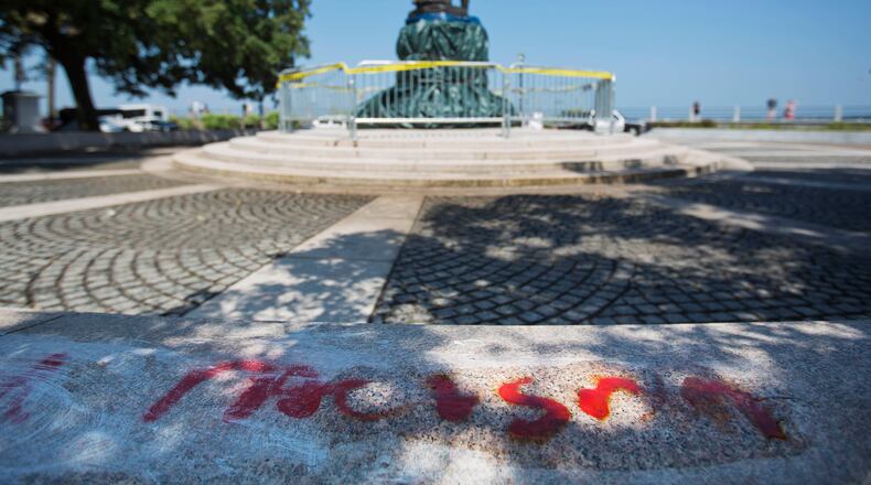 Graffiti near a Confederate statue in Charleston, S.C., this week. (AP file photo)