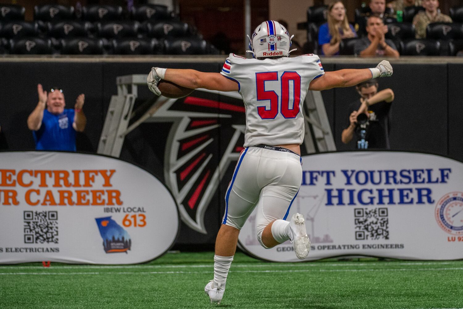 Hayden Halpaus, defenseive lineman for Walton, collects a fumble for a touchdown at Mercedes-Benz Stadium on August 19, 2023. (Jamie Spaar for the Atlanta Journal Constitution)