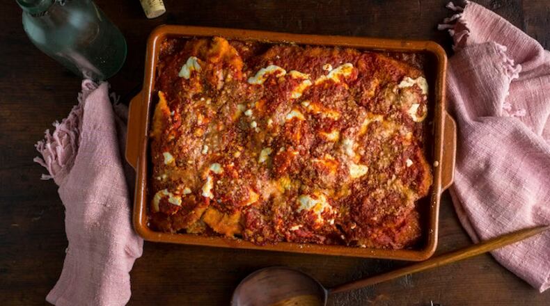 FILE -- A chicken Parmesan casserole in New York, January 2015. Leftover tomato sauce serves as a base for a luscious dinner of chicken or eggplant Parmesan. (Andrew Scrivani/The New York Times)