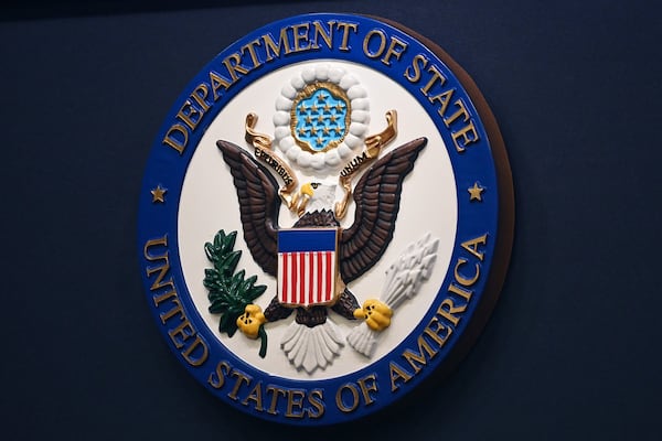 FILE - The State Department seal is seen on the briefing room lectern at the State Department in Washington, Jan. 31, 2022.(Mandel Ngan, Pool via AP, File)
