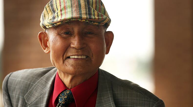 Sang Su Park poses for a photo. In 1992, he and his wife were trapped on the roof of their Five Star Supermarket near the Atlanta University Center when looters ransacked the business and tried to break through a door to get to the couple. Now, Park, speaking through a translator, said he plans to join a peaceful local protest. (Rebecca Wright for The Atlanta Journal-Constitution)