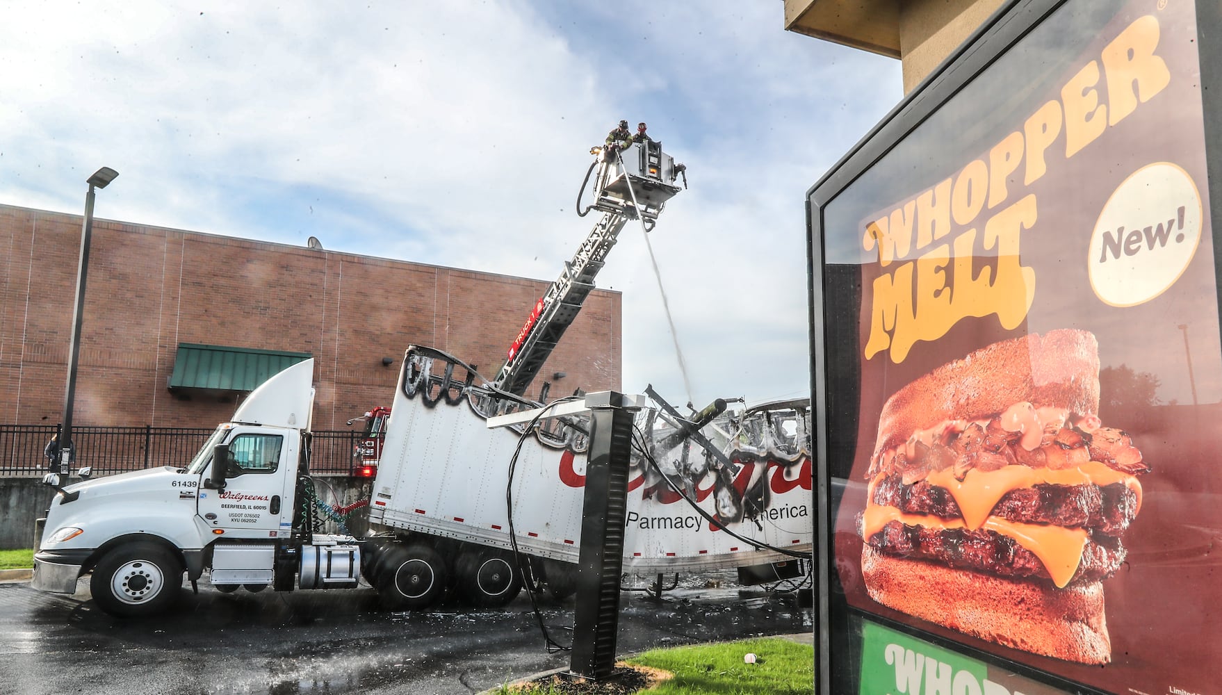 June 23, 2022 Atlanta: DeKalb County firefighters had their hands full Thursday morning, June 23, 2022 with a tractor-trailer fire at a busy intersection that shut down traffic on North Druid Hills Road and affected traffic on I-85. The flames were extinguished near the intersection of North Druid Hills and Briarcliff roads, but fire crews remained at the scene dousing the charred Walgreens truck with water. It appears a power pole fell across its trailer, crushing it. According to the Georgia Department of Transportation, traffic is stopped on the westbound lanes of North Druid Hills Road from Lavista Road all the way to I-85. Traffic on I-85 North is moving slowly on the approach to the North Druid Hills Road exit as the exit ramp has backed up. Power was also affected in the area. (John Spink / John.Spink@ajc.com)


