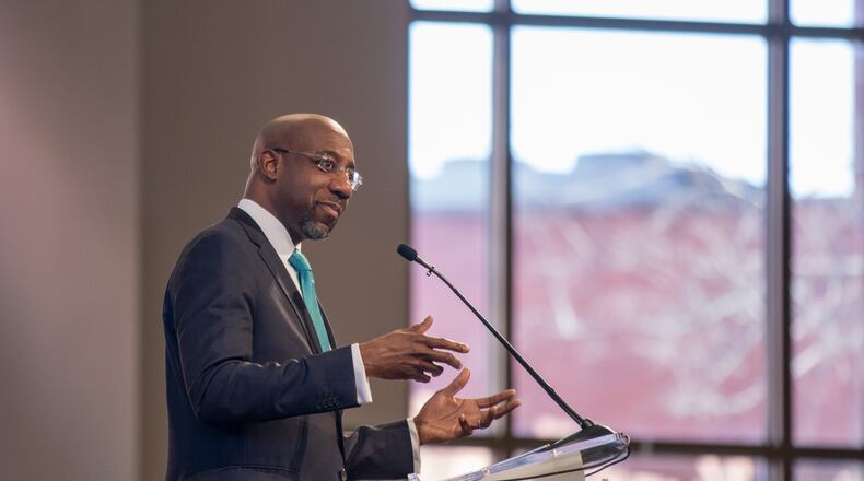 The Rev. Raphael Warnock speaks during the Martin Luther King, Jr. annual commemorative service at Ebenezer Baptist Church in Atlanta. BRANDEN CAMP/SPECIAL