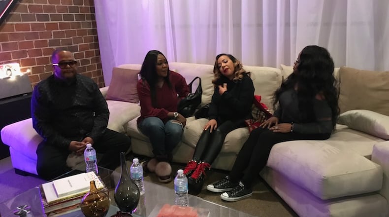 Producer "Tricky" Stewart sits with LaTocha Scott, Tameka "Tiny" Cottle and Tamika Scott at an Atlanta studio Wednesday afternoon. Photo: Ryon Horne/AJC