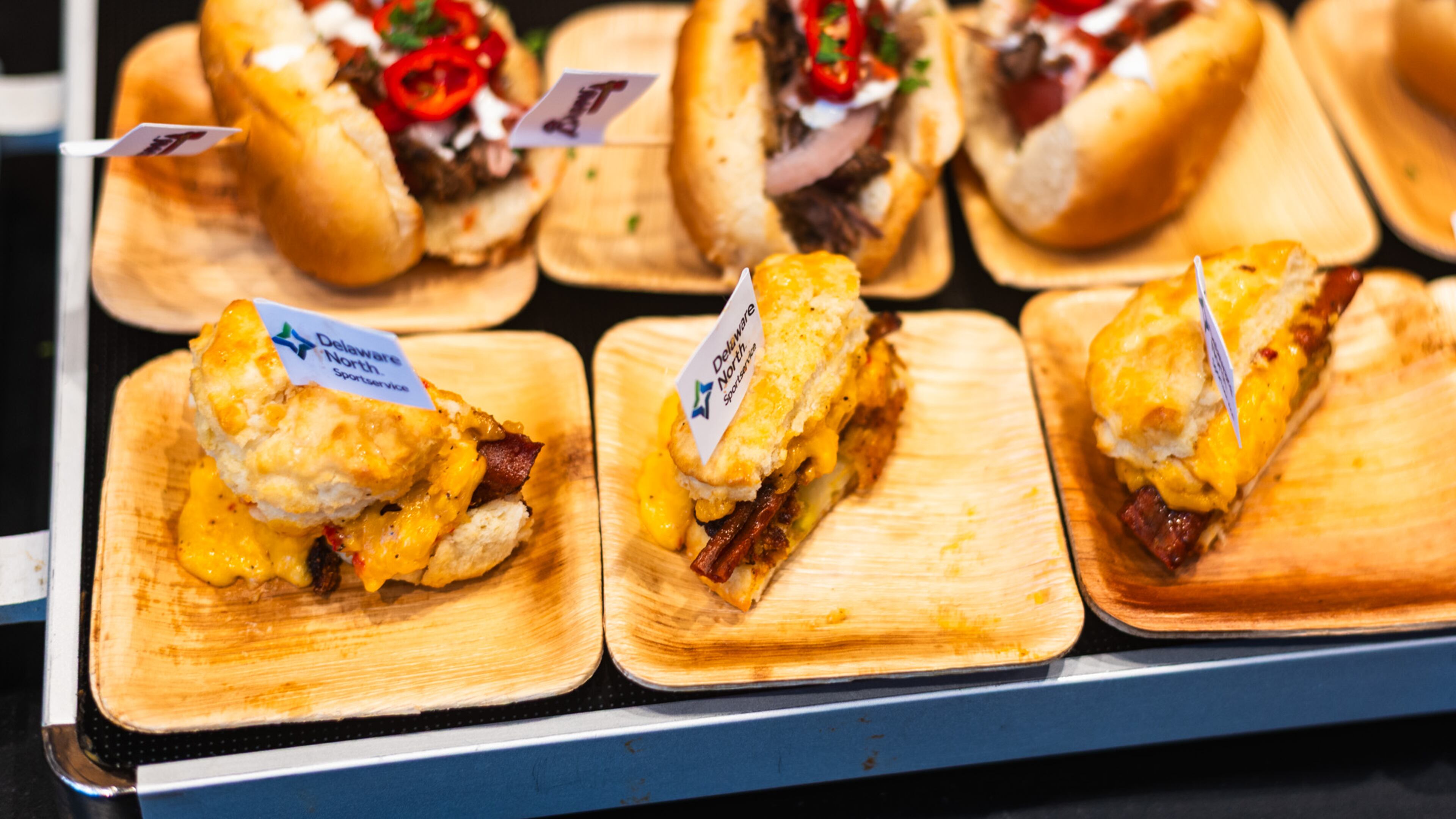 Sample-size versions of new food items at Truist Park, including fried green tomato sliders and birria hot dogs. The Braves and hospitality partner Delaware North announced their culinary lineup Wednesday for All-Star Week. (Henri Hollis/AJC)