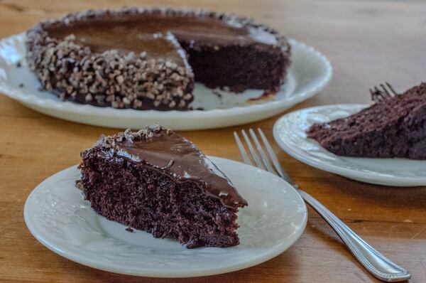 Egg-free Wacky Cake has a dark and rich crumb and decadent chocolate ganache glaze. (Virginia Willis for The Atlanta Journal-Constitution)