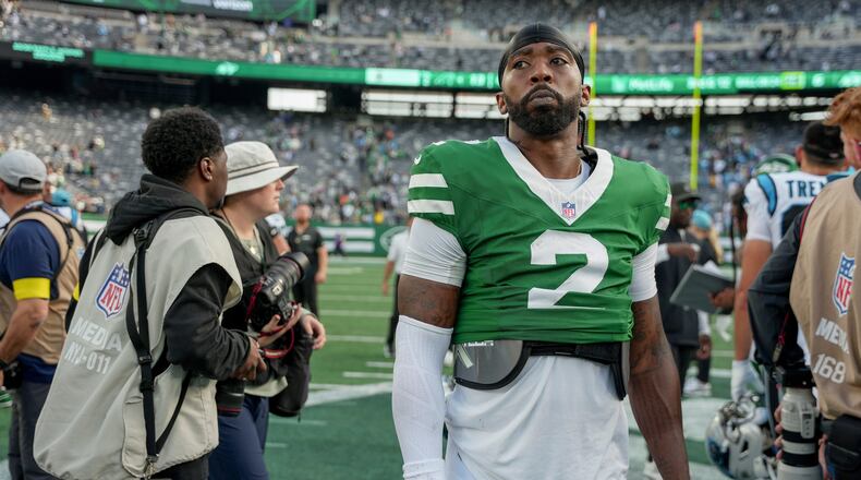 New York Jets quarterback Tyrod Taylor (2) walks off the field after the Jets lost to the Carolina Panthers in an NFL football game, Sunday, Oct. 19, 2025, in East Rutherford, N.J. (AP Photo/Angelina Katsanis)