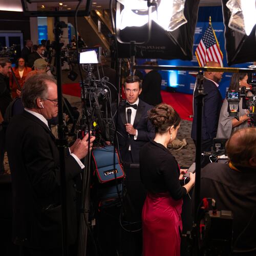 Journalists that were in attendance for the White House Correspondents Dinner work following a press briefing at the Washington Hilton following an incident that disrupted the event, Saturday, April 25, 2026, in Washington. (AP Photo/Allison Robbert)