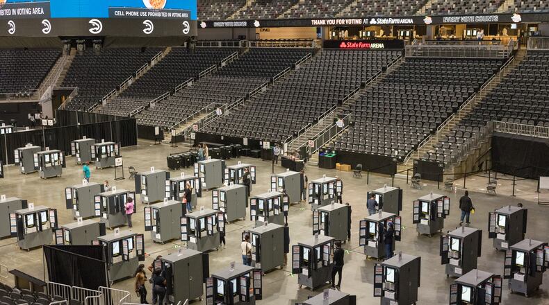 Voters cast their ballots at a polling station at State Farm Arena in Atlanta, on Friday, Oct. 30, 2020, the state's last day of in-person early voting. An unnerved yet energized America is voting with an urgency never seen before in the approach to a presidential election, as a record 85 million people have cast ballots despite an array of challenge. (Lynsey Weatherspoon/The New York Times)