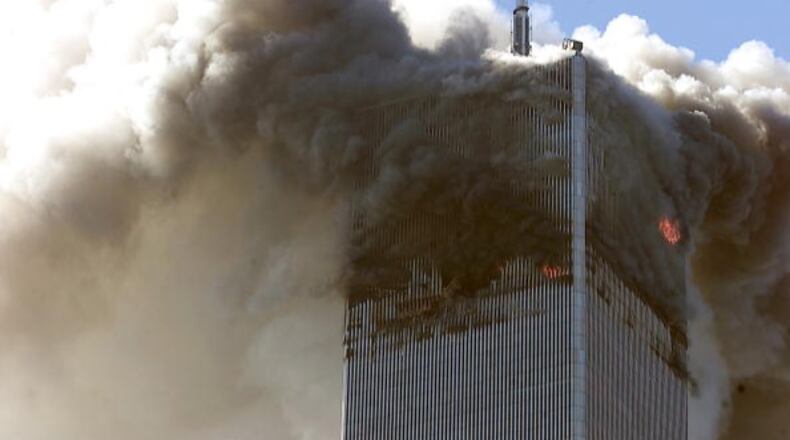 File photo: The north tower of the World Trade Center burns after s hijacked airplane hit it September 11, 2001 in New York City. Almost two years after the September 11 attack on the World Trade Center, the New York Port Authority is releasing transcripts on August 28, 2003 of emergency calls made from inside the twin towers.(Photo by Jose Jimenez/Primera Hora/Getty Images)