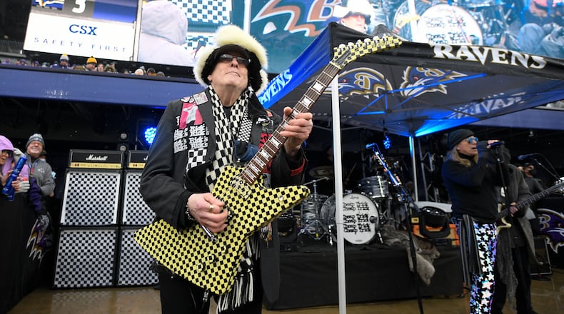 Rick Nielsen, left, and Robin Zander, right, of Cheap Trick perform during halftime of an NFL football game between the Pittsburgh Steelers and the Baltimore Ravens, Sunday, Jan. 9, 2022, in Baltimore. (AP Photo/Nick Wass)