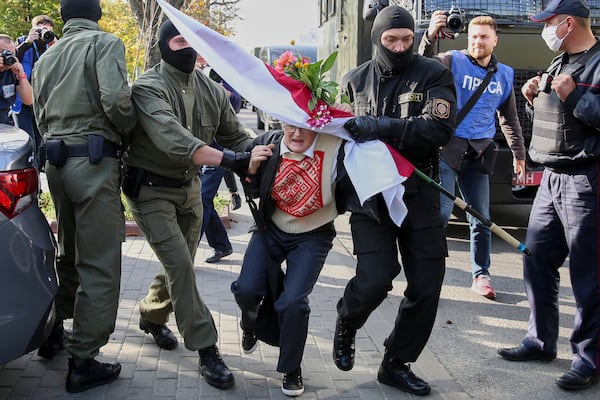 FILE - Police officers detain Nina Bahinskaya, 73, during an opposition rally to protest the official presidential election results in Minsk, Belarus, Saturday, Sept. 19, 2020. (AP Photo/TUT.by, File)