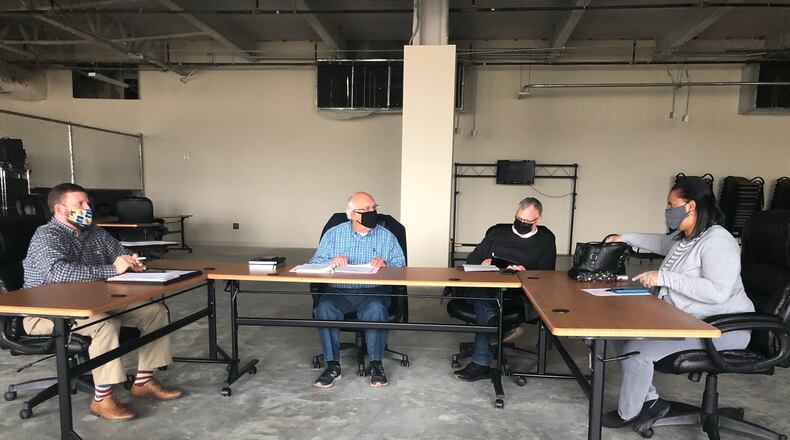 The Newton County elections board decided Thursday to move forward with ballot-counting after a partisan dispute over masks had threatened to halt the election. From left: Board member Dustin Thomson, chairman Philip Johnson, attorney Patrick Jaugstetter and board member Kelly Robinson. MARK NIESSE / mark.niesse@ajc.com