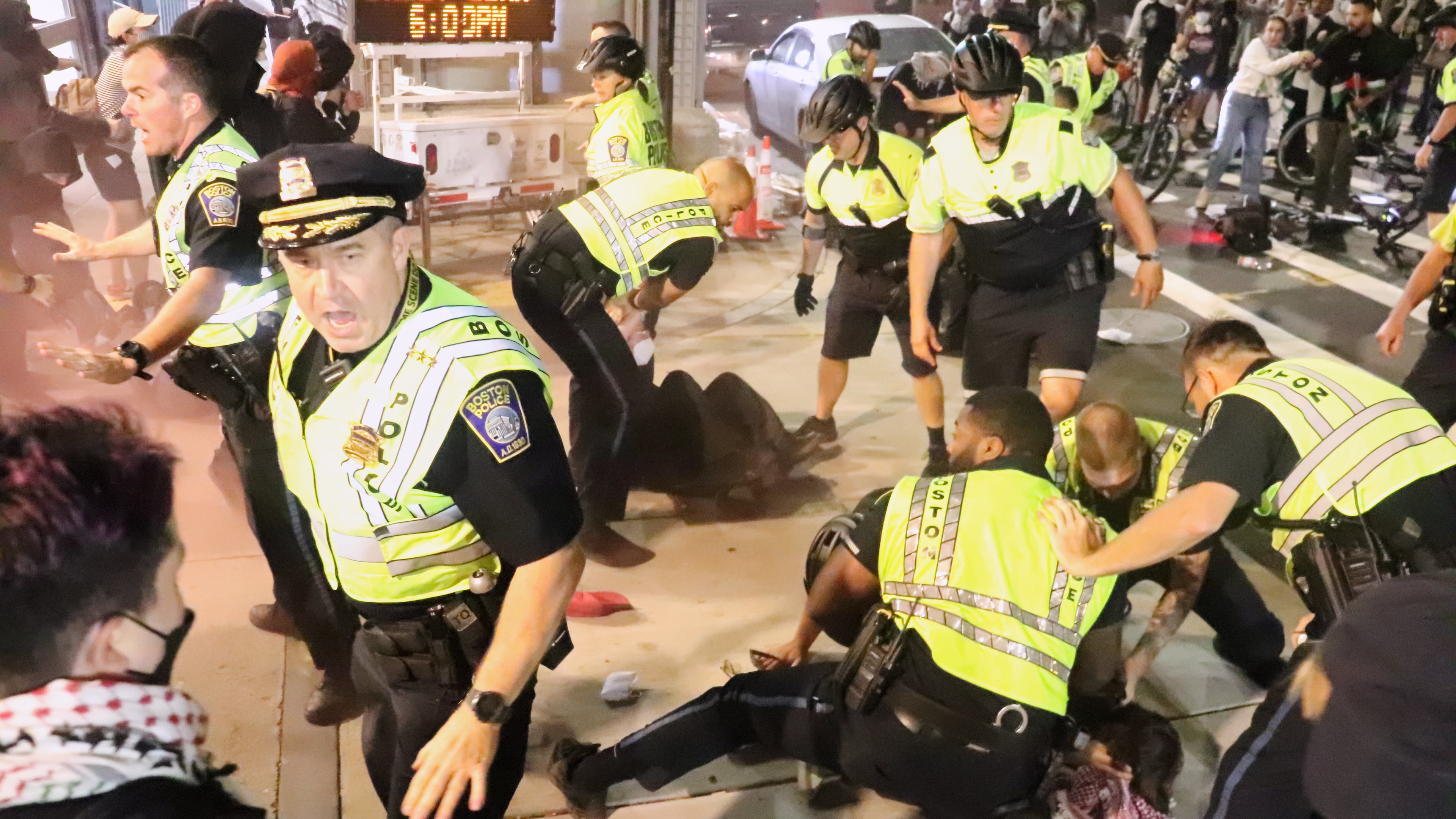 In this photo provided by Bryan Hecht, law enforcement detain a pro-Palestinian protester Tuesday, Oct. 7, 2025, in Boston. (Bryan Hecht/The Berkeley Beacon via AP)