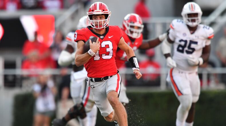 Georgia quarterback Stetson Bennett runs for a touchdown during the second half in a NCAA college football game at Sanford Stadium in Athens on Saturday, October 8, 2022. Georgia won 42-10 over Auburn. (Hyosub Shin / Hyosub.Shin@ajc.com)