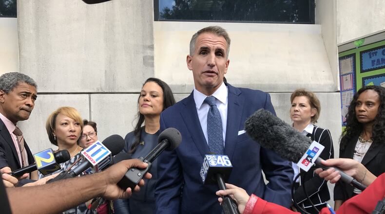 Fulton County Schools Superintendent Jeff Rose, center, and Atlanta Public Schools Superintendent Meria Carstarphen, left, talk to reporters outside Superior Court of Fulton County on Nov. 3, after a judge ordered a temporary tax collection in Fulton County. AJC FILE PHOTO