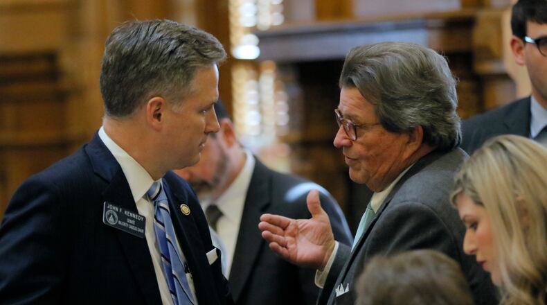 State Rep. Alan Powell (right), R - Hartwell,  confers with Sen. John F. Kennedy, R-Macon, on the senate floor on March 30, 2017.   BOB ANDRES  /BANDRES@AJC.COM