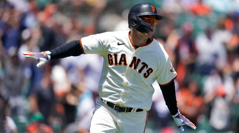 San Francisco Giants' Joc Pederson watches his a two-run home run during a baseball game against the New York Mets in San Francisco, Wednesday, May 25, 2022. (AP Photo/Jeff Chiu)