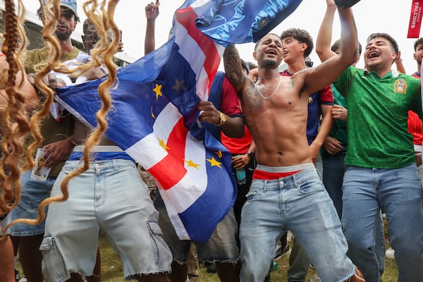 Cape Verde fans celebrate at FIFA Fan Festival in Centennial Olympic Park after Cape Verde's 0-0 draw against World Cup favorite Spain on Monday, June 15, 2026, in Atlanta. It is Cape Verde's first World Cup appearance. (Arvin Temkar/AJC)