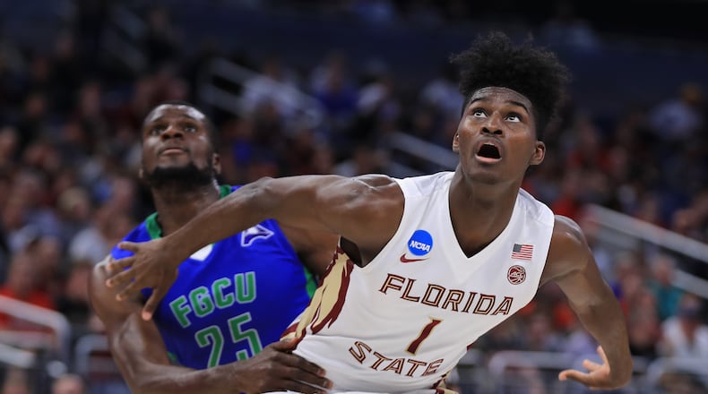 ORLANDO, FL - MARCH 16:  Marc-Eddy Norelia #25 of the Florida Gulf Coast Eagles and Jonathan Isaac #1 of the Florida State Seminoles battle for position during a free throw in the first half during the first round of the 2017 NCAA Men's Basketball Tournament at Amway Center on March 16, 2017 in Orlando, Florida.  (Photo by Mike Ehrmann/Getty Images)