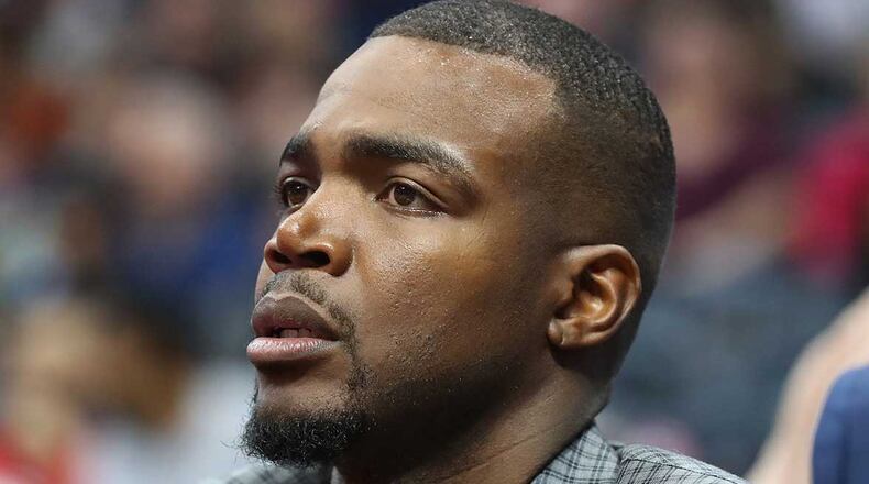 Injured Atlanta Hawks forward Paul Millsap, missing his fifth consecutive game, watches from the bench as his team falls to the Brooklyn Nets 107-92 Sunday, its seventh straight loss.