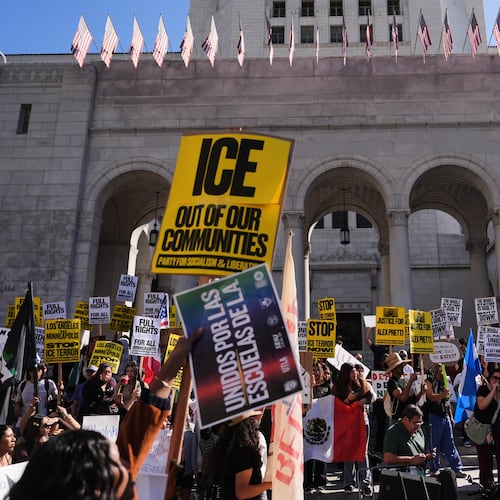 FILE - People gather on the steps of Los Angeles City Hall during a protest on Jan. 30, 2026 in Los Angeles. (AP Photo/Jae C. Hong, File)