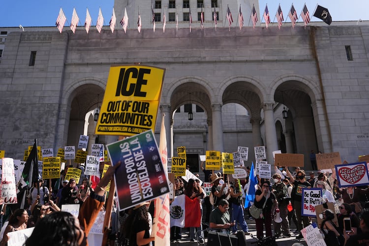 FILE - People gather on the steps of Los Angeles City Hall during a protest on Jan. 30, 2026 in Los Angeles. (AP Photo/Jae C. Hong, File)