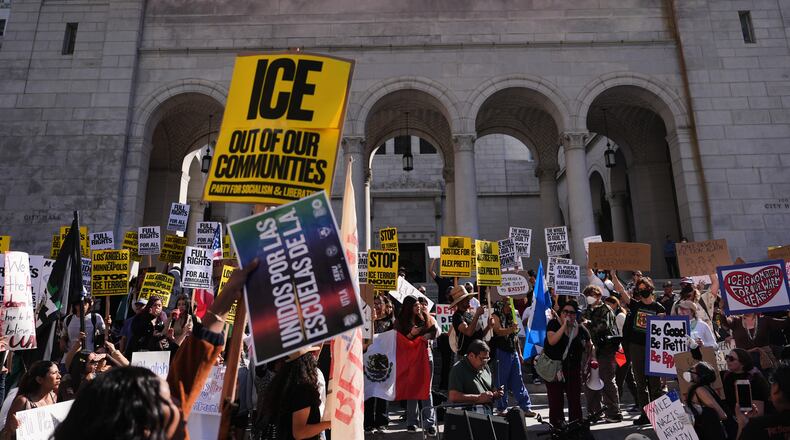 FILE - People gather on the steps of Los Angeles City Hall during a protest on Jan. 30, 2026 in Los Angeles. (AP Photo/Jae C. Hong, File)