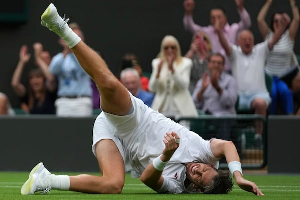 Cameron Norrie of Britain celebrates winning his men's singles fourth round match against Nicolas Jarry of Chile at the Wimbledon Tennis Championships in London, Sunday, July 6, 2025.(AP Photo/Joanna Chan)
