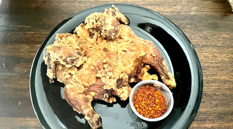 Thinly coated before frying, the whole chicken at Dagu Rice Noodle has a crispy, delicately crunchy exterior. Angela Hansberger for The Atlanta Journal-Constitution