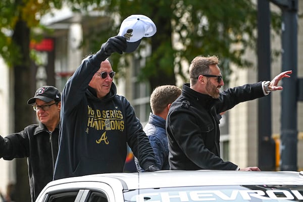 Atlanta Braves radio announcers Joe Simpson (left) and Ben Ingram (right) wave during the championship parade for the 2021 World Champion Atlanta Braves in Atlanta. (John Adams/Icon Sportswire/AP Images)