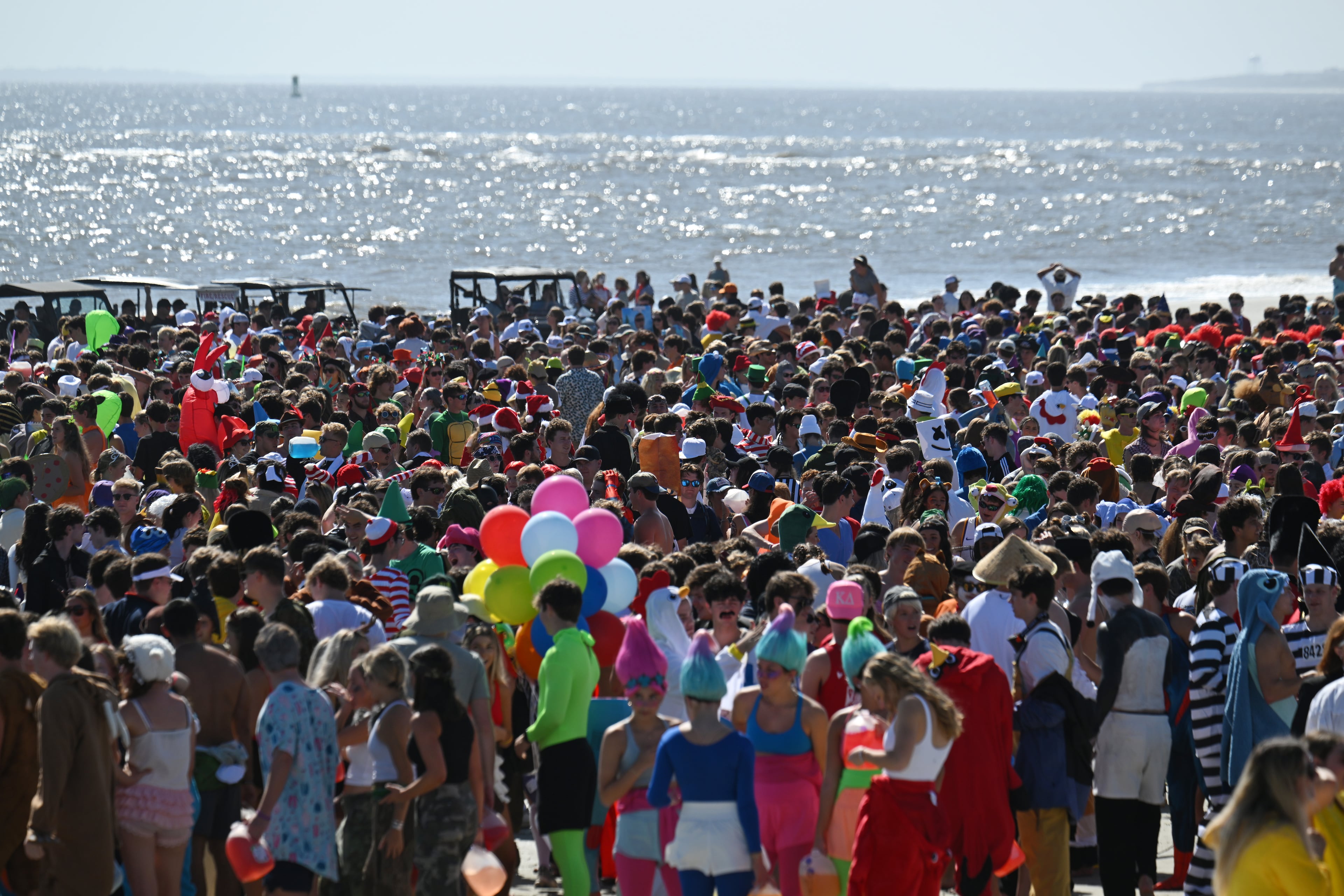 Thousands of UGA students gather during the annual “Frat Beach” party for the weekend of the Georgia-Florida football game on St. Simons Island, Friday, November 1, 2024. On the weekend of the Georgia-Florida football game, St. Simons Island’s East Beach becomes “Frat Beach,” an open-air party teeming with thousands of college students. (Hyosub Shin / AJC)