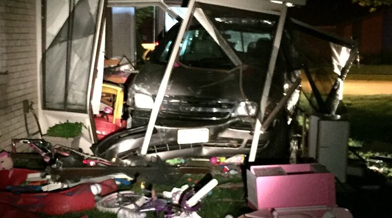 Police in Tipp City say a father was drunk when he crashed into a house on Broadway Street on June 19. Officers add his three children were inside the van at the time of the crash but no one was injured. (Contributed Photo)