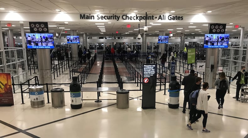 Nov. 25, 2020 - Thousands of travelers passed through Hartsfield-Jackson International Airport on the day before Thanksgiving 2020. But due to COVID-19 crowds were about half what they normally are.