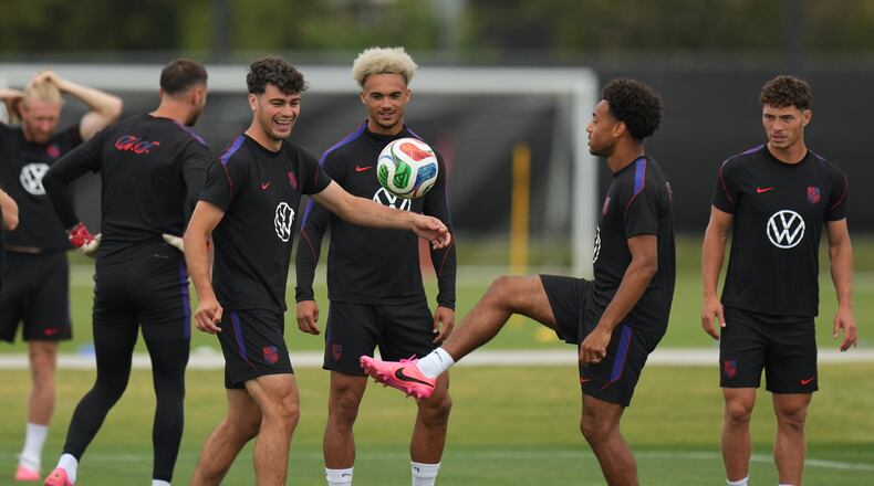 United States' Giovanni Reyna, center left, Antonee Robinson, center, and Tyler Adams practice during a training session ahead of their FIFA World Cup match against Bosnia in Irvine, Calif., Monday, June 29, 2026. (AP Photo/Andre Penner)