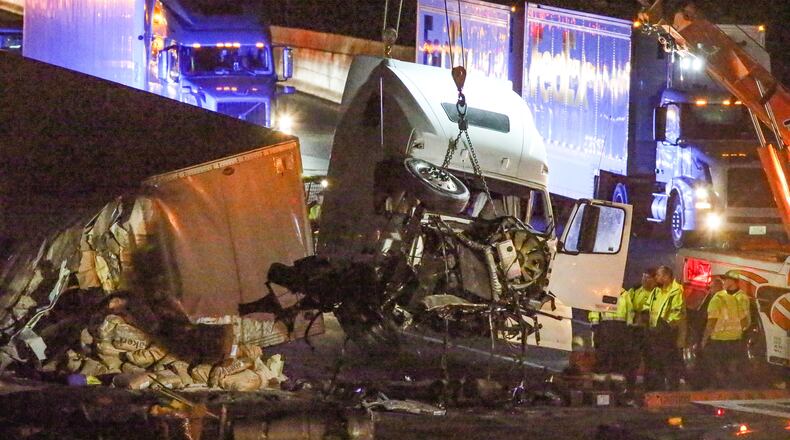 A tractor-trailer overturned at I-75 South and Windy Hill Road in Cobb County about 2 a.m. Wednesday. JOHN SPINK / JSPINK@AJC.COM