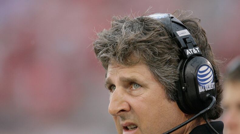 FILE - Texas Tech head coach Mike Leach looks at the scoreboard during the first quarter of a football game against SMU, Sept. 3, 2007, in Dallas. (AP Photo/Matt Slocum, file)