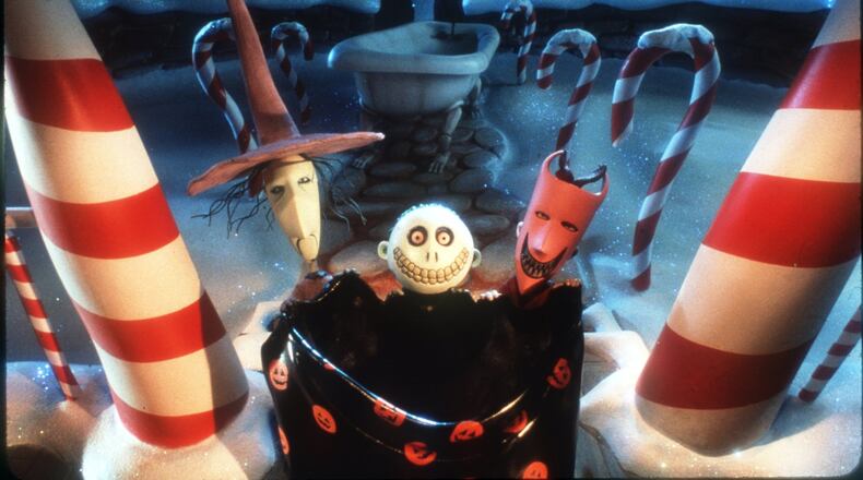 Lock (right), Shock (left), and Barrel (center) get ready to ‘bag’ the real Santa Claus so that the leader of Halloweentown, Jack Skellington, can take his place in Touchstone Pictures’ ‘Tim Burton’s The Nightmare Before Christmas.’ The movie is showing on Oct. 24 at Woodruff Park. ©Touchstone Pictures. All Right Reserved