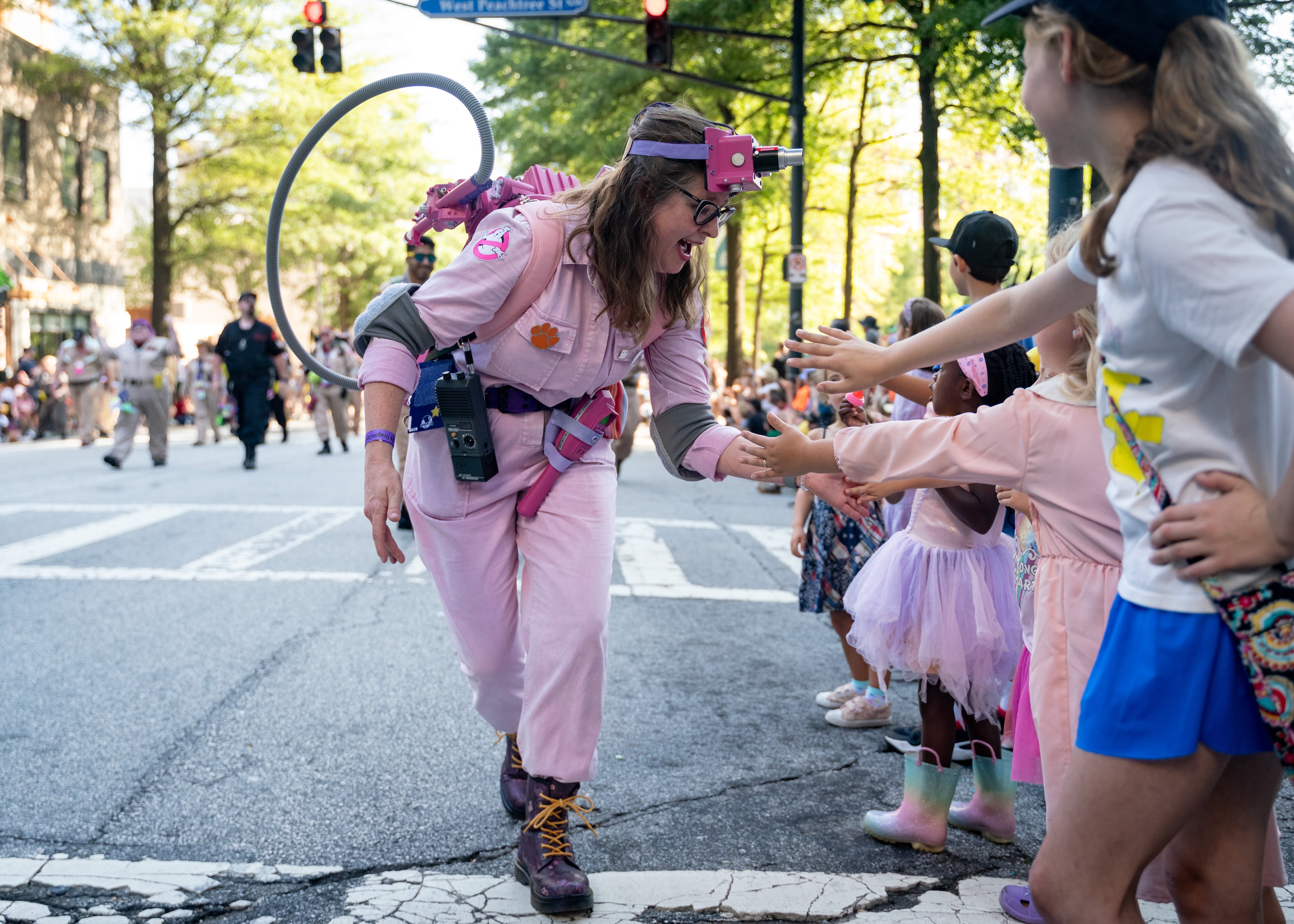 Thousands lined up along Peachtree Street on Saturday morning, August 31, 2024, for the annual Dragon Con parade in Atlanta. For five days, Atlanta is going to be the epicenter of pop culture and an estimated 70,000 people are expected to partake in the annual multi-genre convention. (Ben Hendren for The Atlanta Journal-Constitution)