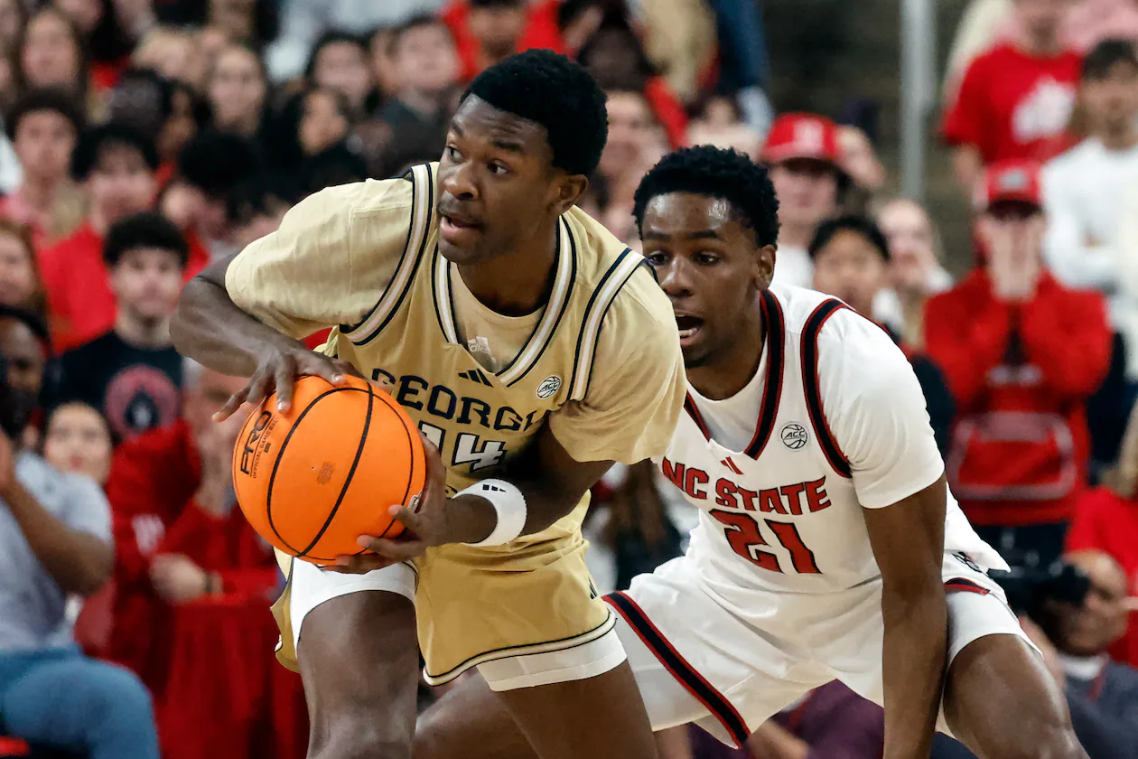 Georgia Tech's Kowacie Reeves Jr. battles for the ball with North Carolina State's Terrance Arceneaux during the first half of an NCAA college basketball game in Raleigh, N.C., Saturday, Jan. 17, 2026. (Karl DeBlaker/AP)