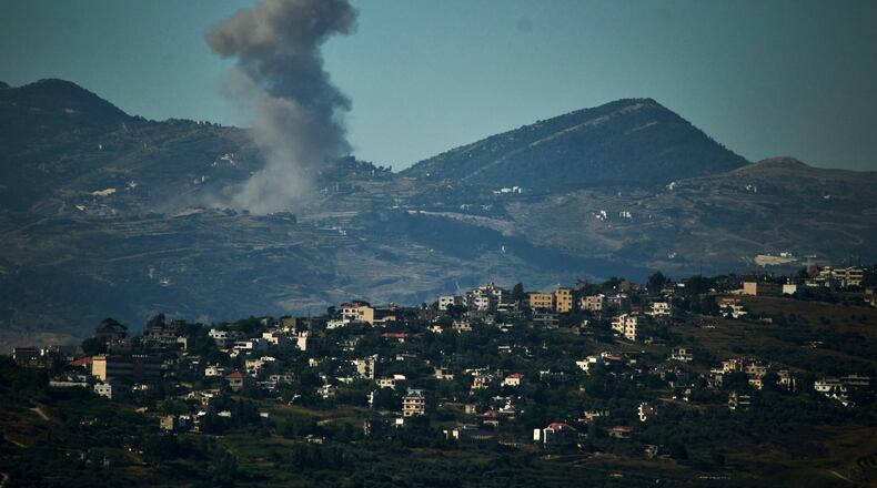 Smoke rises to the sky following an Israeli military strike in southern Lebanon as seen from northern Israel, Friday, June 19, 2026. (AP Photo/Leo Correa)